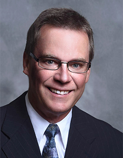 man wearing suit and glasses