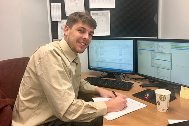 male student working at desk