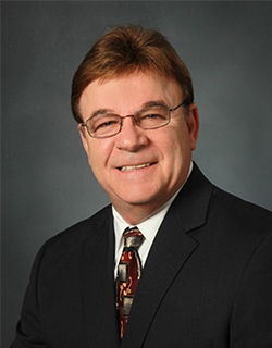 man wearing suit and glasses