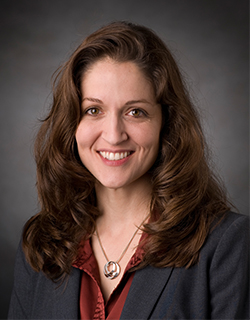 headshot of woman in suit