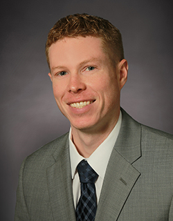 headshot of man in suit