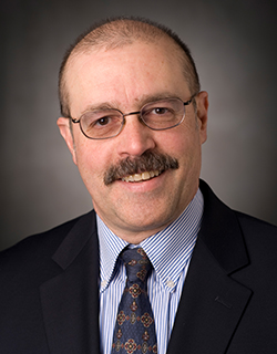 headshot of man in suit