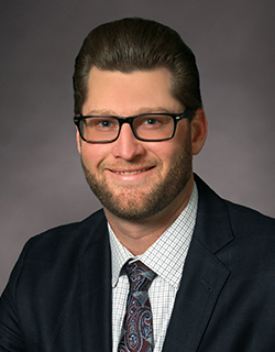 man wearing suit and glasses